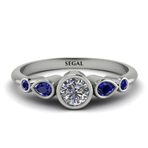bezel_symmetrical_Emerald_Ring_2.jpg